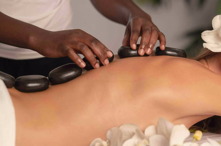 Luxury Hot Stone Massage in Gulshan 2 Dhaka with heated basalt stones at Queen Spa BD